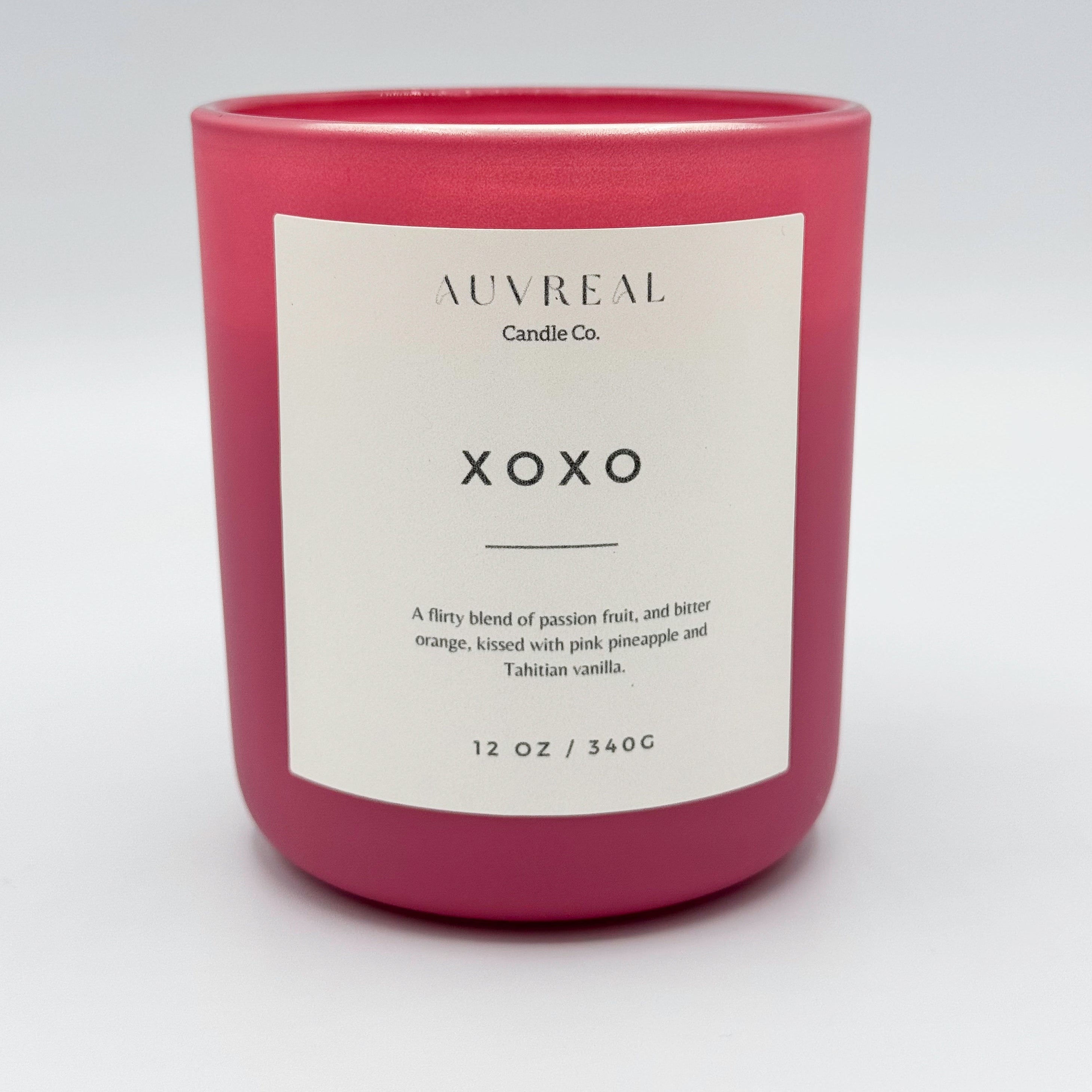 xoxo a luxury candle by auvreal candle co is a flirty blend of passion fruit, and bitter orange, kissed with pink pineapple and tahitian vanilla.